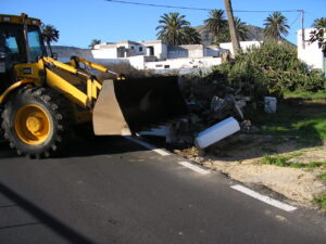 Digger taking the wall out